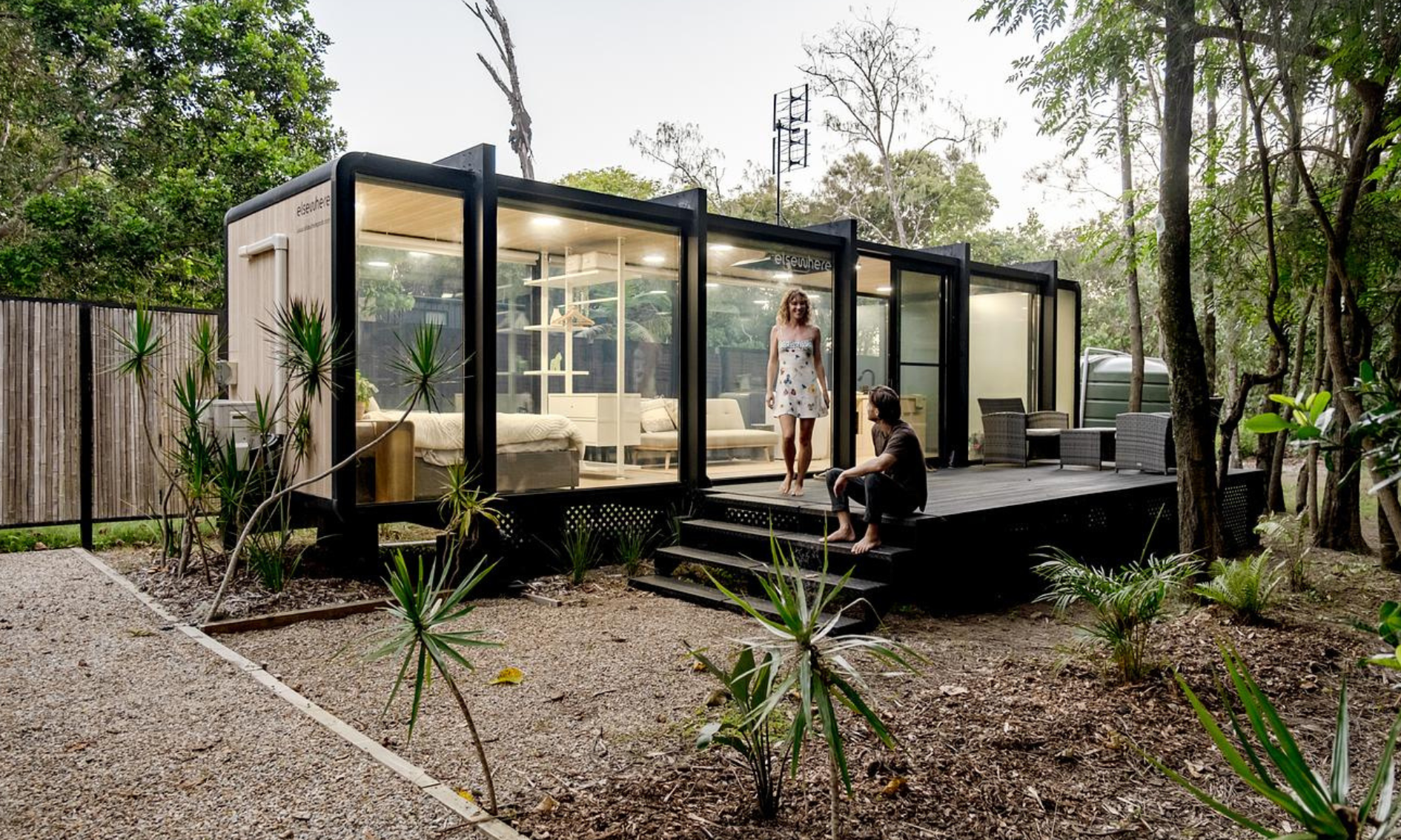 Beautiful Tiny Home with Deck in Byron Bay with couple relaxing outside